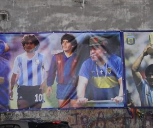 epaselect epa08841715 A series of posters of Diego Maradona stand out on a wall in Naples, Italy, 25 November 2020. Diego Maradona has died after a heart attack, media reports claimed on 25 November 2020.  EPA/CIRO FUSCO