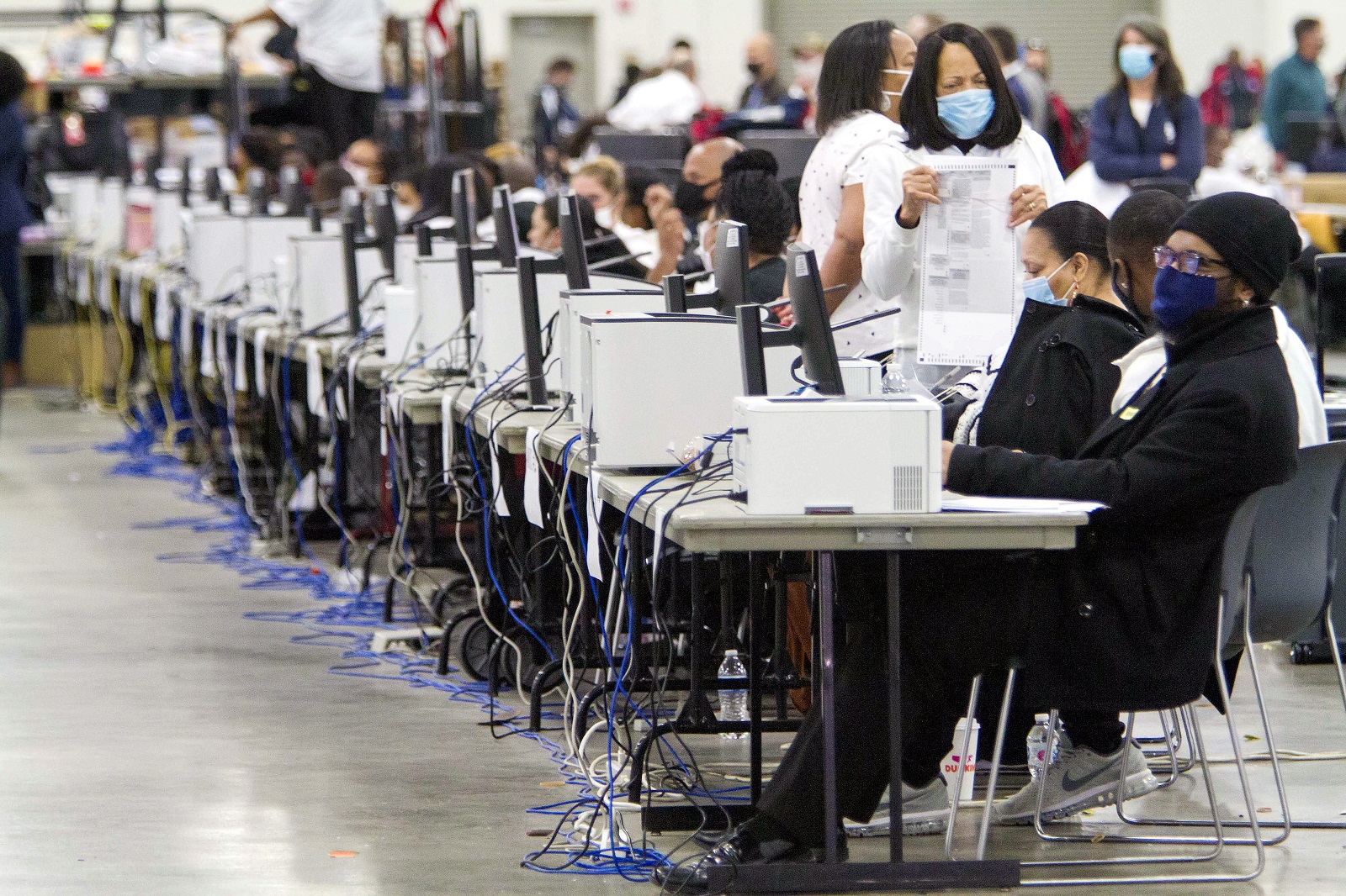 epaselect epa08798612 Absentee Ballots are certified and then counted at TCF Center, in Detroit, Michigan, USA, 04 November 2020. The 2020 Presidential Election result remains undetermined as votes continued to be counted in several key battleground states.  EPA/JEFFREY SAUGER