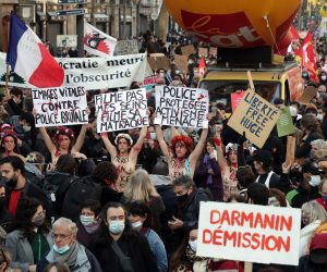 epa08848605 Femen activists hold up placard as they join protesters near Place de la Republique to demonstrate against the controversial global security law undergoing parliamentary approval, in Paris, France, 28 November 2020. The global security legislation in the process of being passed by the French Parliament aims to ban the sharing of photos in which police officers and gendarmes can be identified in a way which is harmful to their image. France has seen several protests opposing the proposed law in the past week - but a recent incident in which French police were caught on security camera footage beating a black man in his record studio in Paris has further fueled the backlash against the new legislation.  EPA/CHRISTOPHE PETIT TESSON