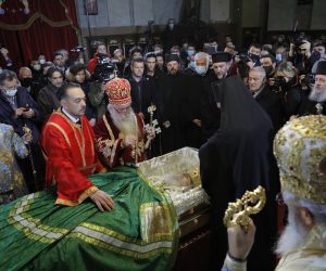epa08832404 Priests pay last respects to the late Serbian Patriarch Irinej in Belgrade, Serbia, 21 November 2020. According to media reports Patriarch Irinej died on 20 November 2020 in Belgrade, Serbia at the age of 90 after being admitted to a hospital for having symptoms of Covid-19 disease.  EPA/MARKO DJOKOVIC