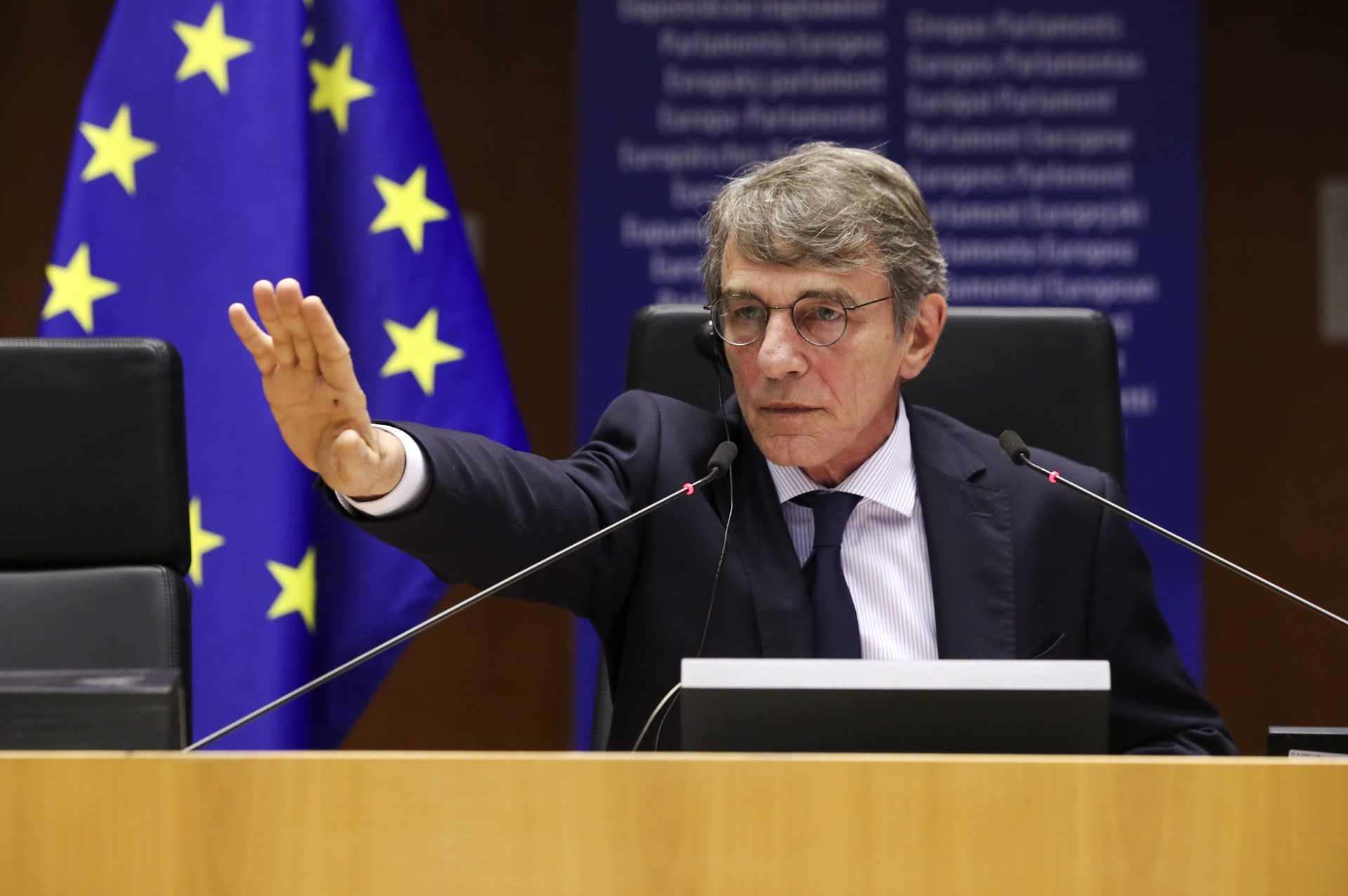 epa08813556 European Parliament President David Sassoli reacts to the people protesting in the building during a plenary session of the European Parliament, in Brussels, Belgium, 11 November 2020.  EPA/YVES HERMAN / POOL