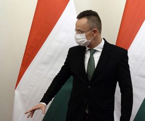 epa08782458 Kosovar Minister of Foreign Affairs and Diaspora Meliza Haradinaj-Stublla (L) and Hungarian Minister of Foreign Affairs and Trade Peter Szijjarto chat in the latter's office during their meeting in Budapest, Hungary, 29 October 2020.  EPA/Lajos Soos HUNGARY OUT