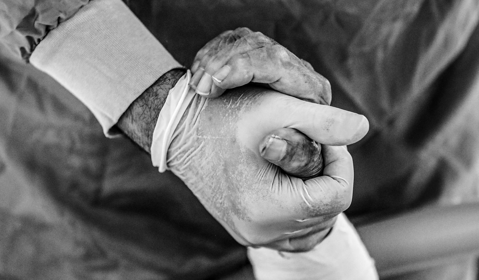 epa08872039 A doctor holds a hand of COVID-19 patient inside a sealed Intensive Care Unit (ICU) room at the Prof. Dr. Cemil Tascioglu City Hospital, in Istanbul, Turkey, 07 December 2020 (issued 09 December 2020). According to latest reports, Turkey recorded 33,198 new coronavirus infections on 08 December 2020, the highest daily number in Europe. Since the start of the Covid-19 pandemic more than 15,000 people have died in Turkey, including 211 health workers, who take care of coronavirus patients, according to Turkey Medical Association. Turkish government in November 2020 has signed a contract to buy 50 million doses of Chinese manufacturer Sinovac coronavirus vaccine ‘CoronaVac’, to be delivered in batches between December 2020 and February 2021. Turkey is also in talks to increase the amount of coronavirus vaccines from Pfizer and BioNTech companies, from initial one million doses. Healthcare workers, people aged 65 and above, disabled people, people who stay in shelters and those living in crowded places will be vaccinated in the first stage, Turkish Health Ministry said.  EPA/SEDAT SUNA ATTENTION: This Image is part of a PHOTO SET
