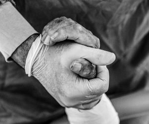epa08872039 A doctor holds a hand of COVID-19 patient inside a sealed Intensive Care Unit (ICU) room at the Prof. Dr. Cemil Tascioglu City Hospital, in Istanbul, Turkey, 07 December 2020 (issued 09 December 2020). According to latest reports, Turkey recorded 33,198 new coronavirus infections on 08 December 2020, the highest daily number in Europe. Since the start of the Covid-19 pandemic more than 15,000 people have died in Turkey, including 211 health workers, who take care of coronavirus patients, according to Turkey Medical Association. Turkish government in November 2020 has signed a contract to buy 50 million doses of Chinese manufacturer Sinovac coronavirus vaccine ‘CoronaVac’, to be delivered in batches between December 2020 and February 2021. Turkey is also in talks to increase the amount of coronavirus vaccines from Pfizer and BioNTech companies, from initial one million doses. Healthcare workers, people aged 65 and above, disabled people, people who stay in shelters and those living in crowded places will be vaccinated in the first stage, Turkish Health Ministry said.  EPA/SEDAT SUNA ATTENTION: This Image is part of a PHOTO SET