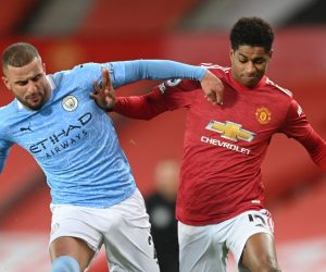 epa08879895 Marcus Rashford (R) of Manchester United in action against Kyle Walker (C) of Manchester City during the English Premier League soccer match between Manchester United and Manchester City in Manchester, Britain, 12 December 2020.  EPA/Michael Regan / POOL EDITORIAL USE ONLY. No use with unauthorized audio, video, data, fixture lists, club/league logos or 'live' services. Online in-match use limited to 120 images, no video emulation. No use in betting, games or single club/league/player publications.