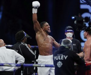 epa08880756 Defending WBA (Super), IBF, WBO, and IBO world champion Anthony Joshua of Britain (L) reacts after beating Kubrat Pulev of Bulgaria by TKO in the ninth round during their heavyweight world title bout at the SSE Arena in London, Britain, 12 December 2020.  EPA/Andrew Couldridge / POOL