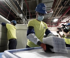 epa08881569 Boxes containing the Pfizer-BioNTech COVID-19 vaccine are prepared to be shipped at the Pfizer Global Supply Kalamazoo manufacturing plant in Portage, Michigan, USA, 13 December 2020.  EPA/MORRY GASH / POOL