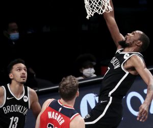 epa08882931 Brooklyn Nets forward Kevin Durant (R) shoots and scores during the first half of a  preseason game between the Washington Wizards and the Brooklyn Nets at Barclays Center in Brooklyn, New York, USA, 13 December 2020.  EPA/Peter Foley  SHUTTERSTOCK OUT