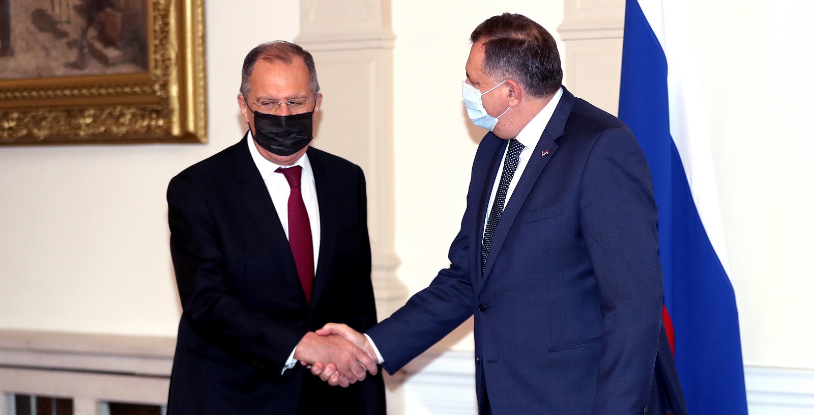 epa08884881 Russian Minister of Foreign Affairs Sergei Lavrov (L) shakes hands with Chairman of Bosnian Presidency Milorad Dodik (R) in Sarajevo, Bosnia and Herzegovina, 15 December 2020. Lavrov arrived for a two-day working visit to Bosnia and Herzegovina.  EPA/FEHIM DEMIR