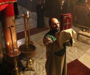epa08895835 Priests pray during a mass at the Holy Cave in the Church of Nativity in the West Bank town of Bethlehem, 20 December 2020. Palestinian Authorities imposed a total lockdown in West Bank from 20 December – 02 January, due to the increase in COVID-19 cases among Palestinians, with one-day exceptions of the  Bethlehem city to allow the Christmas market.  EPA/ABED AL HASHLAMOUN
