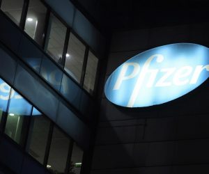 epa08898700 An exterior view of a logo on a building  of biopharmaceutical company Pfizer in Paris, France, 21 December 2020. The European Commission approved to use the Pfizer Biontech vaccine after the European Medicines Agency (EMA) gave the green light to European countries to start COVID-19 vaccinations in the coming days, following regulatory approval for the use of a shot jointly developed by US company Pfizer and its German partner BioNTech.  EPA/Julien de Rosa