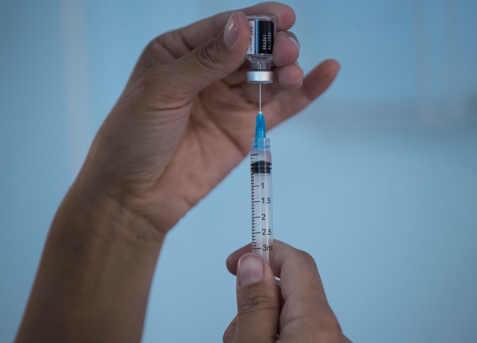 epa08903084 A nurse prepares a vaccine against COVID-19 in Santiago, Chile, 24 December 2020. Chile became the second country in Latin America to start the vaccination process against COVID-19 after Mexico, by immunizing several members of the health sector just hours after receiving the first batch of the vaccine from Pfizer-BioNTech.  EPA/Alberto Valdes