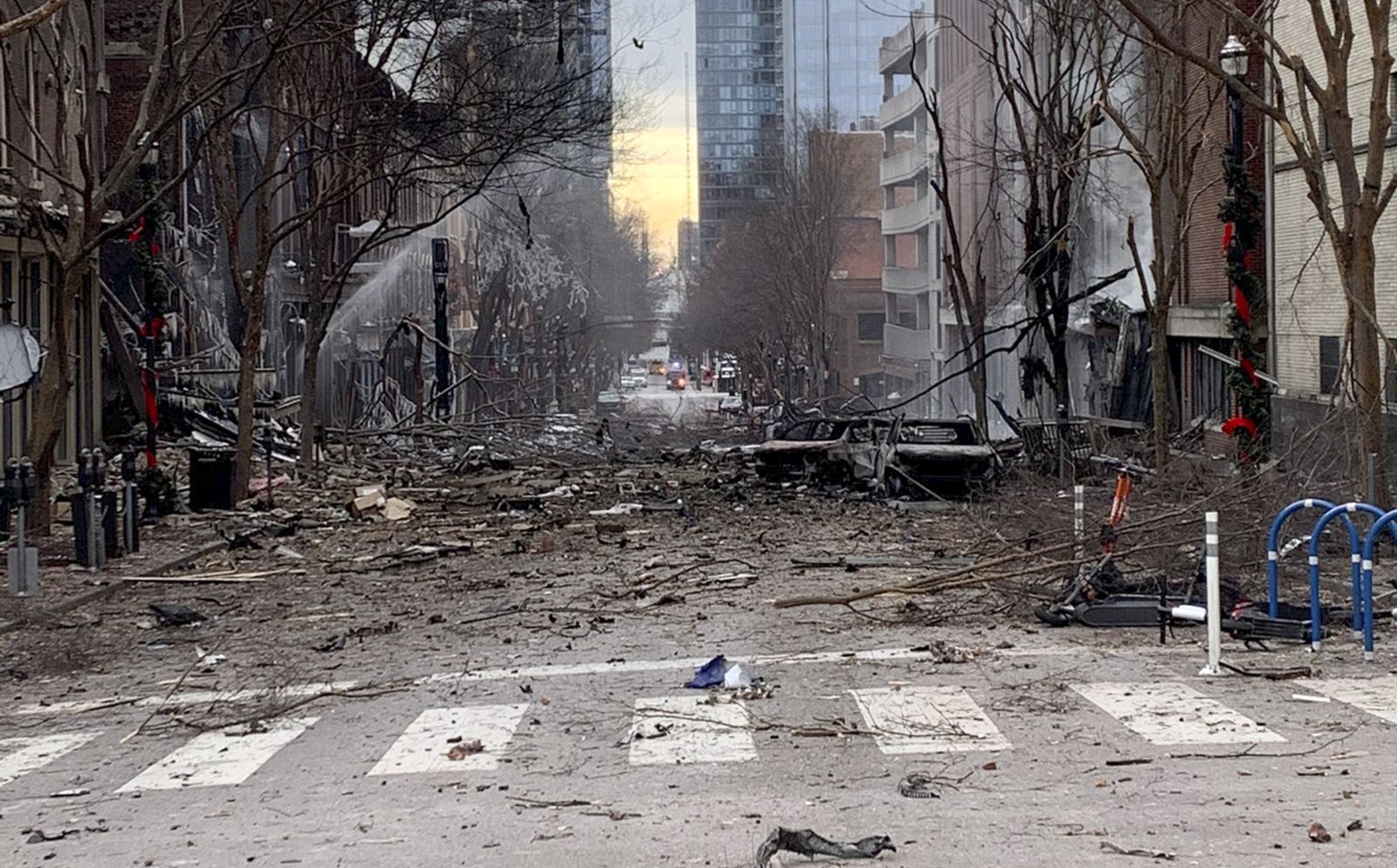 epa08903846 A handout photo made available by Nashville Fire Department shows damage from an explosion that officials believe was an intentional act in Nashville, Tennessee, USA, 25 December 2020. According to reports authorities were alerted to a suspicious vehicle which soon exploded injuring three people and damaging buildings and vehicles nearby. Local police have closed access to the downtown area and are being assisted by agents from the Federal Bureau of Investigation and the Bureau of Alcohol, Tobacco, Firearms and Explosives.  EPA/NASHVILLE FIRE DEPARTMENT / HANDOUT  HANDOUT EDITORIAL USE ONLY/NO SALES