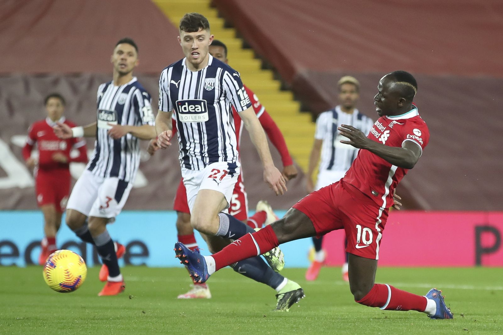 epa08906634 Liverpool's Sadio Mane (R) scores the 1-0 lead during the English Premier League soccer match between Liverpool FC and West Bromwich Albion in Liverpool, Britain, 27 December 2020.  EPA/Nick Potts / POOL EDITORIAL USE ONLY. No use with unauthorized audio, video, data, fixture lists, club/league logos or 'live' services. Online in-match use limited to 120 images, no video emulation. No use in betting, games or single club/league/player publications.