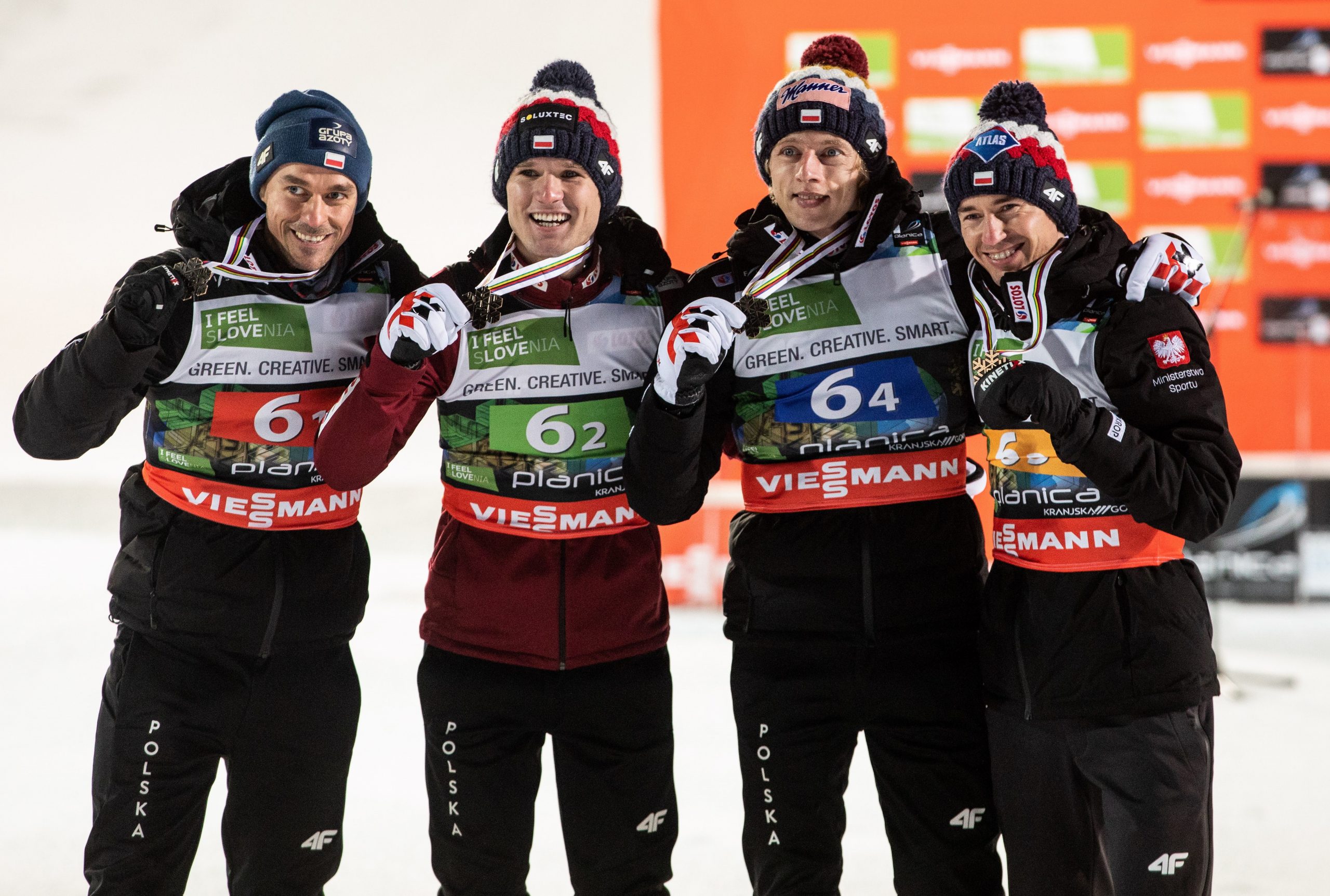 epa08882219 Piotr Zyla of Poland, Andrzej Stekala of Poland, Dawid Kubacki of Poland and Kamil Stoch of Poland pose with their bronze medals during the award ceremony of the Men's HS240 Team competition at the Ski Flying World Championships in Planica, Slovenia, 13 December 2020.  EPA/VID PONIKVAR