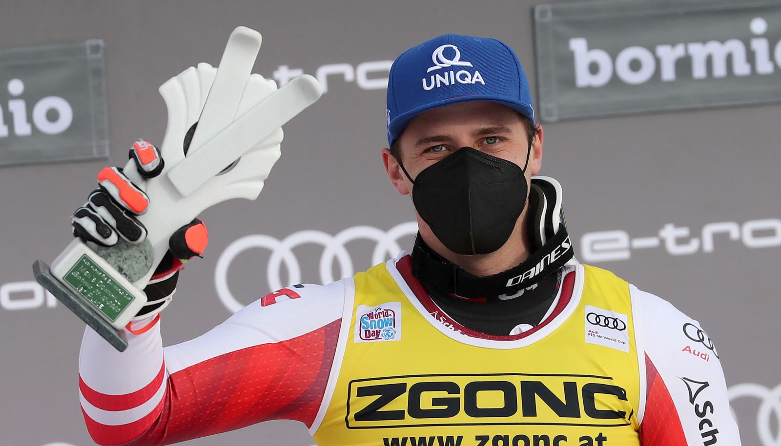 epa08911242 Winner Matthias Mayer of Austria celebrates on the podium after the Men's Downhill race at the FIS Alpine Skiing World Cup in Bormio, Italy, 30 December 2020.  EPA/ANDREA SOLERO