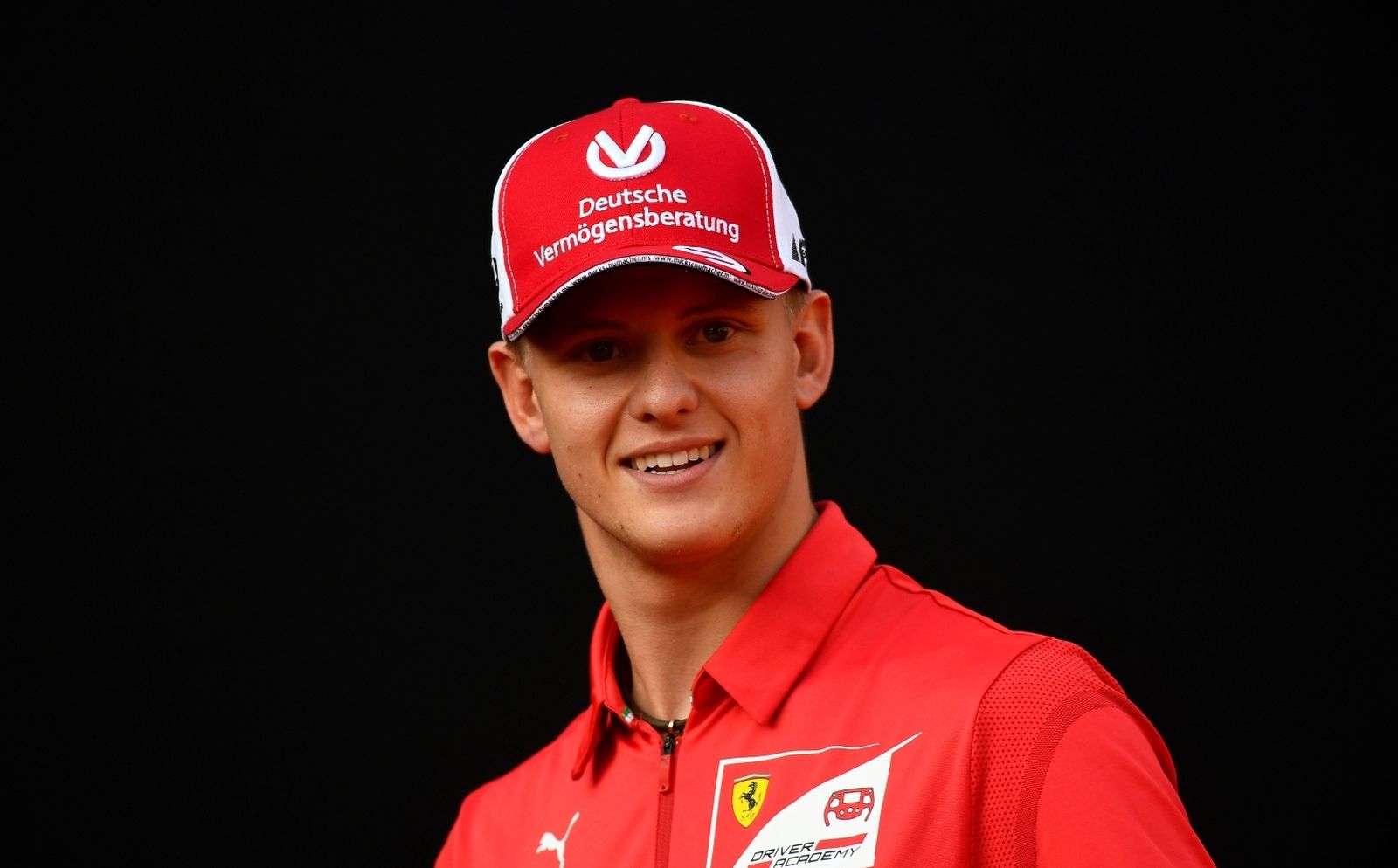 FILE PHOTO: Italian premium sports car maker Ferrari celebrates 90 years of its racing team at Milan's Duomo square FILE PHOTO: Racing driver Mick Schumacher attends an event to celebrate 90 years of Italian premium sports car maker Ferrari racing team at Milan's Duomo square, in Milan, Italy September 4, 2019. REUTERS/Flavio lo Scalzo/File Photo FLAVIO LO SCALZO