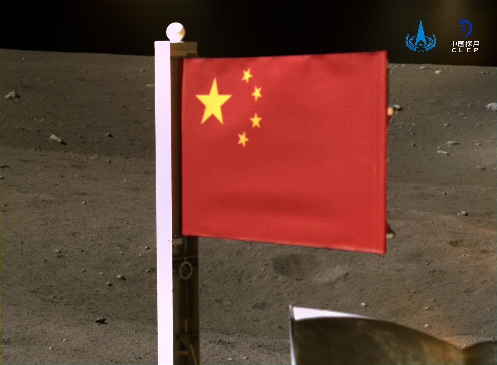 epa08861587 A handout photo made available by the China National Space Administration (CNSA) on 04 December 2020 and taken by a panoramic camera installed on the lander-ascender combination of the probe, before the ascender blasted off from the moon with lunar samples, shows China's national flag unfurled from the Chang'e-5 probe on the moon on 03 December 2020.  EPA/CHINA NATIONAL SPACE ADMINISTRATION / HANDOUT HANDOUT EDITORIAL USE ONLY HANDOUT EDITORIAL USE ONLY/NO SALES