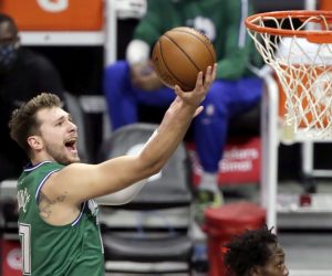 epa08906947 Dallas Mavericks guard Luka Doncic (L) drives to the basket over Los Angeles Clippers guard Patrick Beverley during the first half of the NBA basketball game between Dallas Mavericks and Los Angeles Clippers at Staples Center in Los Angeles, California, USA, 27 December 2020.  EPA/ALEX GALLARDO  SHUTTERSTOCK OUT SHUTTERSTOCK OUT