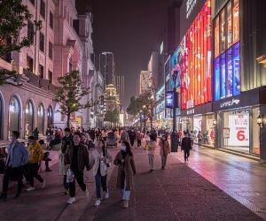 epa08908118 People walk in a shopping street in Wuhan, China, 28 December 2020. Life in Wuhan, a Chinese city of more than 11 million, which nearly a year ago became the epicenter of the coronavirus outbreak is returning to normal. Since May the capital of Hubei province has not recorded locally-transmitted cases of Covid-19.  EPA/ROMAN PILIPEY