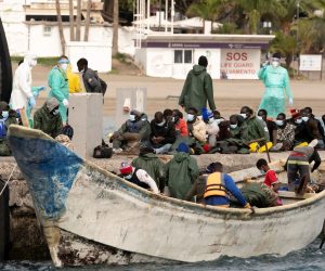 epa08917122 A total of 50 migrants arrive on a small boat at Los Cristianos port after being rescued by Spanish Maritime Safety and Rescue Society in Tenerife, Canary Islands, Spain, 03 January 2020.  EPA/Miguel Barreto