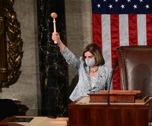 epa08917854 US Speaker of the House Nancy Pelosi wields the Speaker's gavel after being re-elected as Speaker and preparing to swear in members of the 117th House of Representatives in Washington, USA, 03 January 2021.  EPA/ERIN SCOTT / POOL