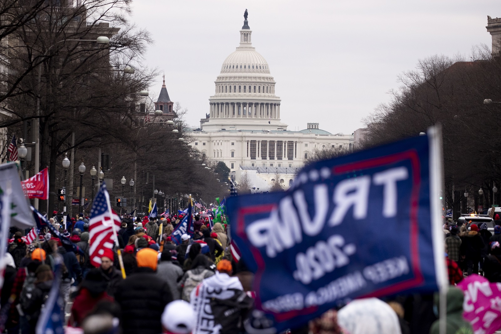 epa08923287 Pro-Trump protesters march down Pennsylvania Avenue to the US Capitol (seen behind) in Washington, DC, USA, 06 January 2021. Right-wing conservative groups are protesting against Congress counting the electoral college votes. Dozens of state and federal judges have shot down challenges to the 2020 presidential election, finding the accusations of fraud to be without merit.  EPA/MICHAEL REYNOLDS