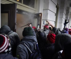 epa08923665 Pro-Trump protesters are pepper sprayed as they attempt to storm the grounds of the US Capitol, in Washington, DC, USA, 06 January 2021. Various groups of Trump supporters have broken into the US Capitol and rioted as Congress prepares to meet and certify the results of the 2020 US Presidential election.  EPA/WILL OLIVER