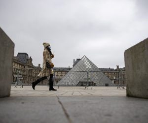 epa08924850 Metal barriers block the access to the pyramids of the Louvre museum in Paris, France, 07 January 2021. Cultural sites including museums, cinemas and theatres were originally due to reopen on 07 January 2021 after shutting on 28 October 2020 as part of the second lockdown, but the government decided to put the reopening plans on hold due to the surge in covid-19 cases.  EPA/IAN LANGSDON