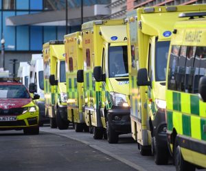 epa08924893 Ambulances line up outside the Royal London Hospital, in London, Britain, 07 January 2021. Britain's National Health Service (NHS) is coming under severe pressure as COVID-19 hospital admissions continue to rise across the United Kingdom. Some 1,000 people are dying each day from the disease.  EPA/ANDY RAIN
