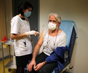 epa08925215 A medical staff member older than 50 is administered the Pfizer-BioNTech COVID-19 vaccine at the Semur en Auxois hospital center in Semur-en-Auxois, near Dijon, France, 07 January 2020. France began its coronavirus disease (COVID-19) vaccination campaign on 27 December 2020. The French government has faced criticism over the slow progress of its drive to vaccinate people, a problem compounded by the high levels of public skepticism about the campaign.  EPA/CHRISTOPHE PETIT TESSON