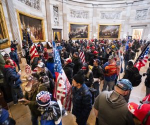 epa08926301 Supporters of US President Donald J. Trump and his baseless claims of voter fraud run through the Rotunda of the US Capitol after breaching Capitol security during their protest against Congress certifying Joe Biden as the next president in Washington, DC, USA, 06 January, 2020 (issued 08 January 2020). On 08 January Assistant House Speaker Katherine Clarke said the House will move to impeach President Trump if the Vice President and Cabinet do not remove him on their own.  EPA/JIM LO SCALZO