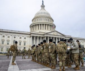 epa08931501 Members of the New York National Guard form up on the East Front of the US Capitol in Washington, DC, USA, 11 January 2021. Speaker of the House Nancy Pelosi has said she will introduce articles of impeachment today against US President Donald J. Trump for incitement of insurrection following the attack on the Capitol last week as lawmakers worked to certify Joe Biden as the next President of the United States.  EPA/SHAWN THEW