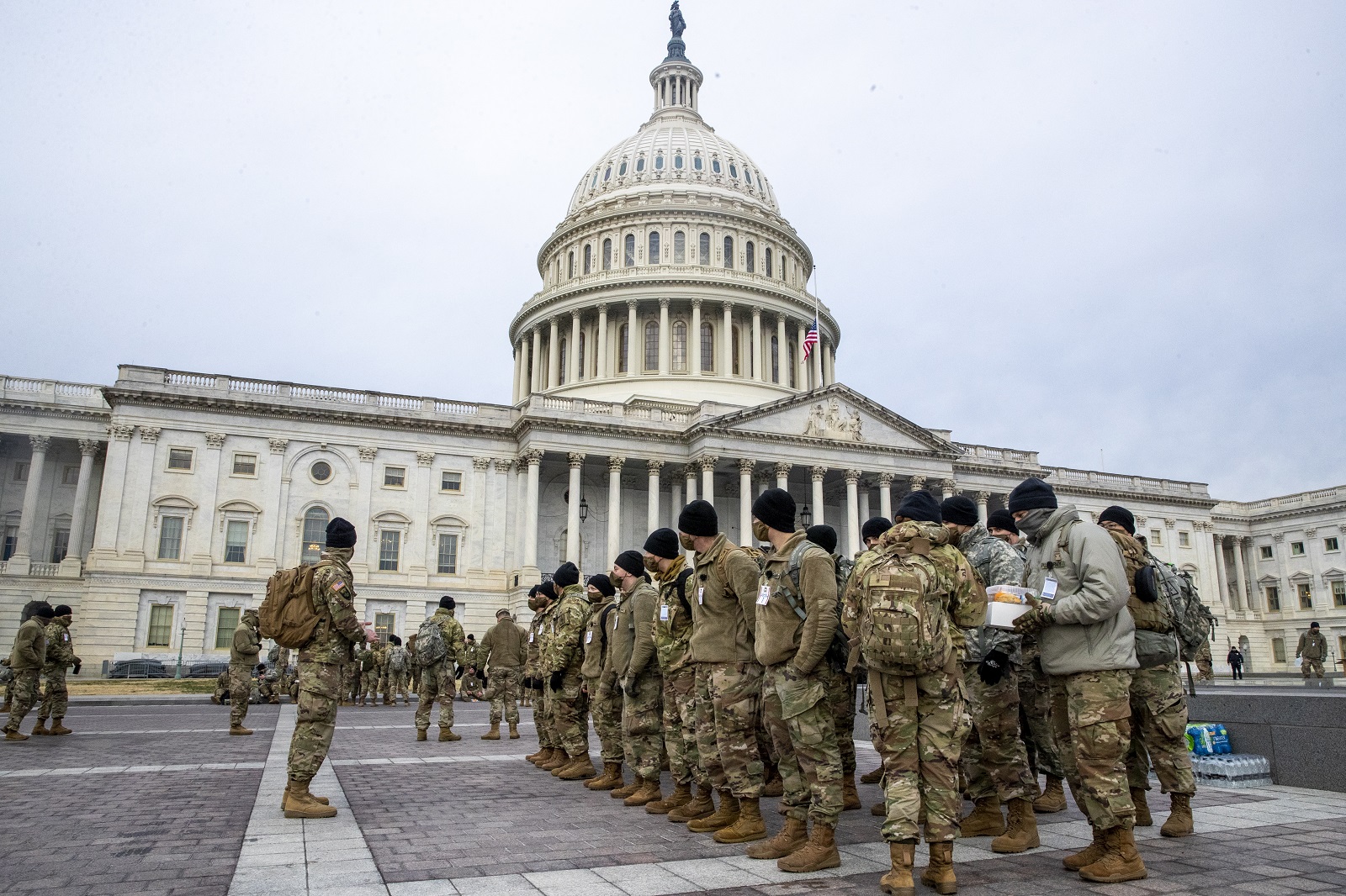 epa08931501 Members of the New York National Guard form up on the East Front of the US Capitol in Washington, DC, USA, 11 January 2021. Speaker of the House Nancy Pelosi has said she will introduce articles of impeachment today against US President Donald J. Trump for incitement of insurrection following the attack on the Capitol last week as lawmakers worked to certify Joe Biden as the next President of the United States.  EPA/SHAWN THEW