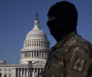 epa08933147 A member of the US National Guard stands on the grounds of the East Front of the US Capitol in Washington, DC, USA, 12 January 2021. At least ten thousand troops of the National Guard will be deployed in Washington by the end of the week, with the possibility of five thousand more, to help secure the Capitol area ahead of more potentially violent unrest in the days leading up to the Inauguration of US President-elect Biden. Democrats are attempting to impeach incumbent US President Trump after he incited a mob of his supporters to riot on the US Capitol in an attempt to thwart Congress from certifying Biden's election victory.  EPA/MICHAEL REYNOLDS