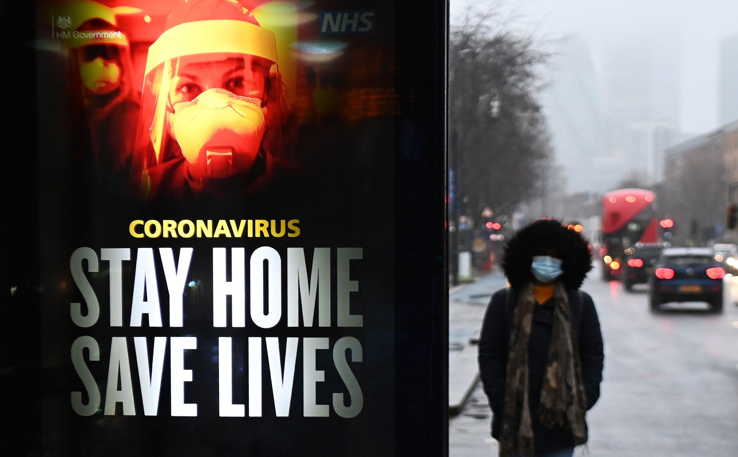 epa08934330 A public health notice to 'stay home' is seen at a bus stop in London, Britain, 13 January 2021. Britain's National Health Service (NHS) is under intense pressure as Covid-19 hospital admissions continue to rise across the UK. Every day, around a thousand people die from the disease.  EPA/ANDY RAIN