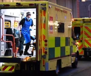 epa08934637 NHS Ambulance staff outside the Royal London hospital in London, Britain, 13 January 2021. Britain's national health service (NHS) is coming under sever pressure as Covid-19 hospital admissions continue to rise across the UK.  EPA/ANDY RAIN