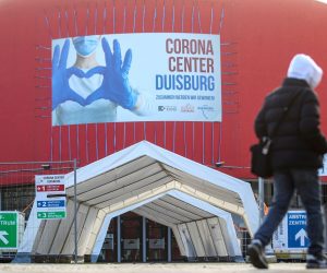 epa08937405 A sign read 'Corona Center Duisburg' at a vaccination center in Duisburg, Germany, 14 January 2021. Due to the low availability of vaccine and the priority given to vaccination in retirement homes, the vaccination centers in North Rhine-Westphalia will not open until February.  EPA/FRIEDEMANN VOGEL