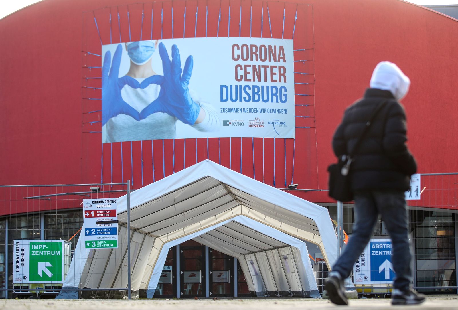 epa08937405 A sign read 'Corona Center Duisburg' at a vaccination center in Duisburg, Germany, 14 January 2021. Due to the low availability of vaccine and the priority given to vaccination in retirement homes, the vaccination centers in North Rhine-Westphalia will not open until February.  EPA/FRIEDEMANN VOGEL