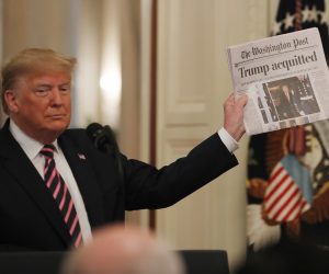 epa08939630 (FILE) US President Donald J. Trump holds the front page of the Washington Post with headline 'Trump acquitted' as he speaks in the East Room of the White House a day after his Senate impeachment trial acquittal in Washington, DC, USA, 06 February 2020. Trump was found not guilty on two articles of impeachment 05 February 2020 after a two-week trial. The presidency of Donald Trump, which records two presidential impeachments, will end at noon on 20 January 2021.  EPA/ERIK S. LESSER *** Local Caption *** 55854439