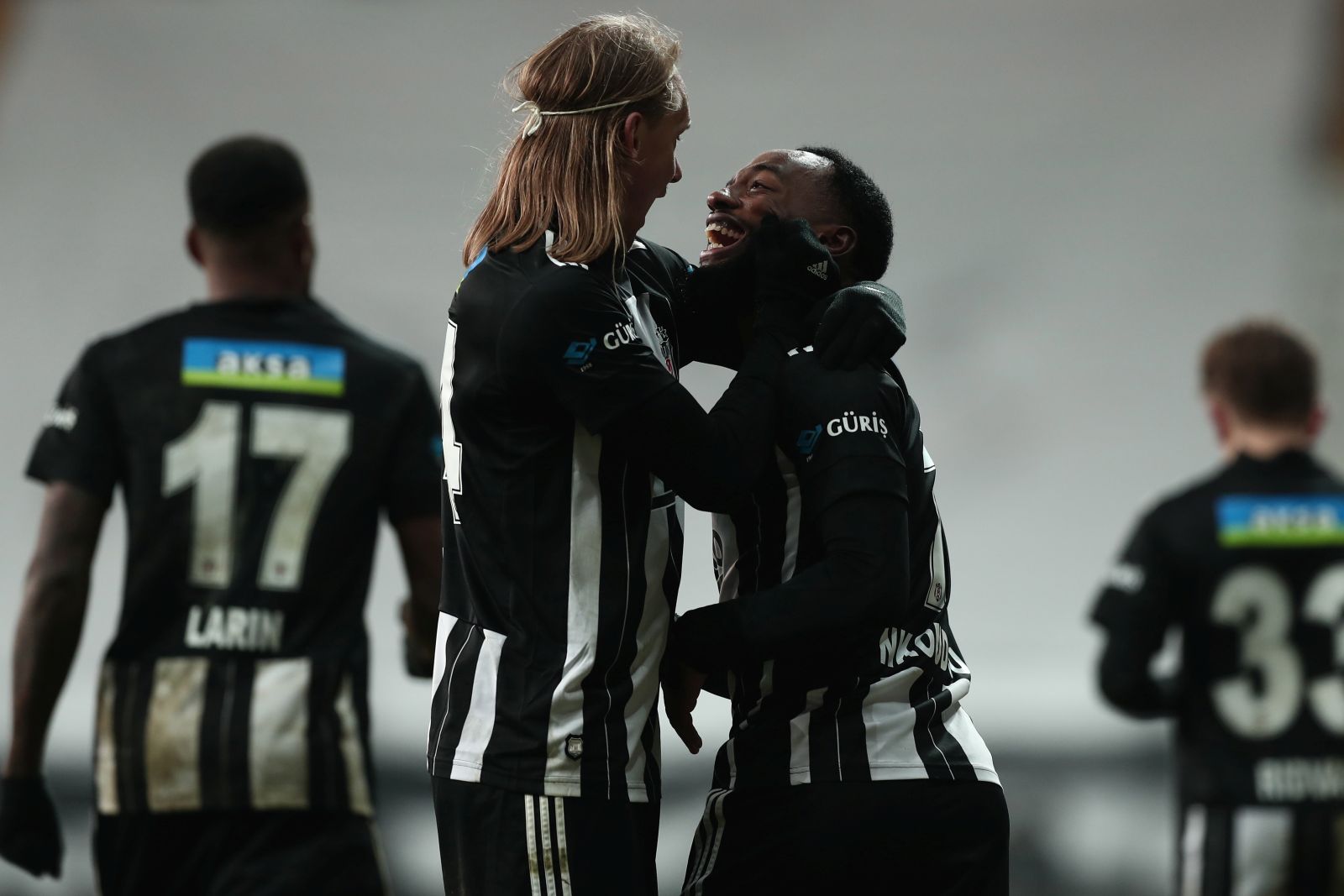 epa08944412 Georges-Kevin N'Koudou (R) of Besiktas celebrates with teammate Domagoj Vida (L) after scoring the 2-0 goal during the Turkish Super League soccer derby match between Besiktas and Galatasaray in Istanbul, Turkey, 17 January 2021.  EPA/SEDAT SUNA