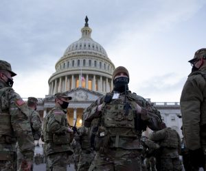 epa08947445 Members of the National Guard stand at the East Front of the US Capitol at dusk, as preparation continues for the inauguration of Joe Biden as the 46th president of the United States, in Washington, DC, USA, 18 January 2021. Intense security measures and a massive force of up to twenty-five thousand troops of the National Guard will be deployed in Washington to help secure the Capitol area for the inauguration of Joe Biden.  EPA/MICHAEL REYNOLDS