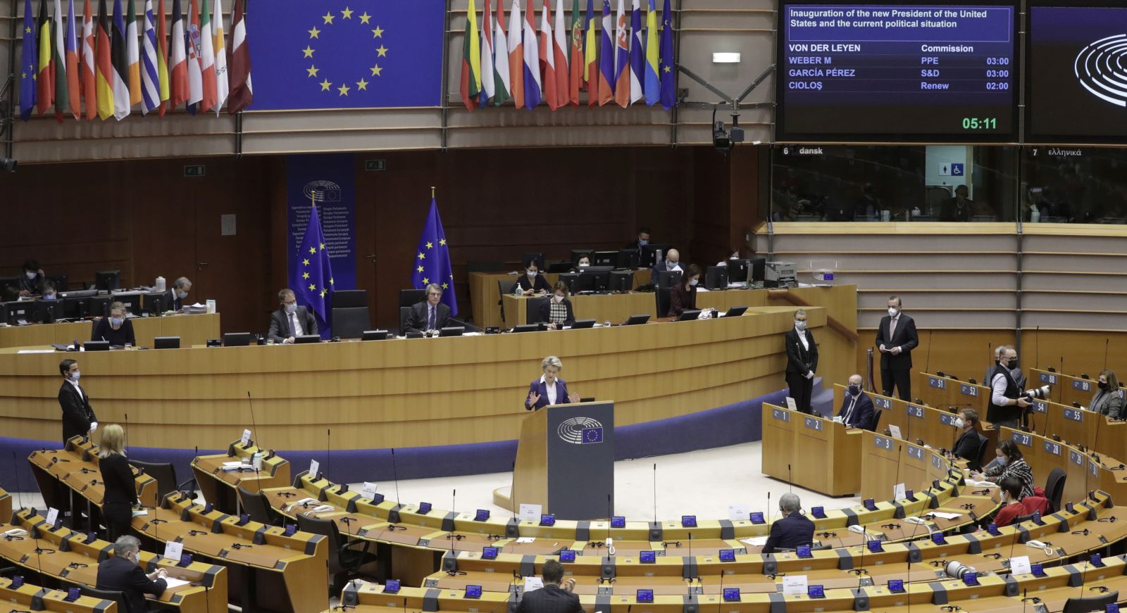 epa08950762 European Commission President Ursula von der Leyen (C, standing) speaks during a debate on the inauguration of the new President of the United States and the current political situation, during a plenary session of the European Parliament, in Brussels, Belgium, 20 January 2021.  EPA/OLIVIER HOSLET