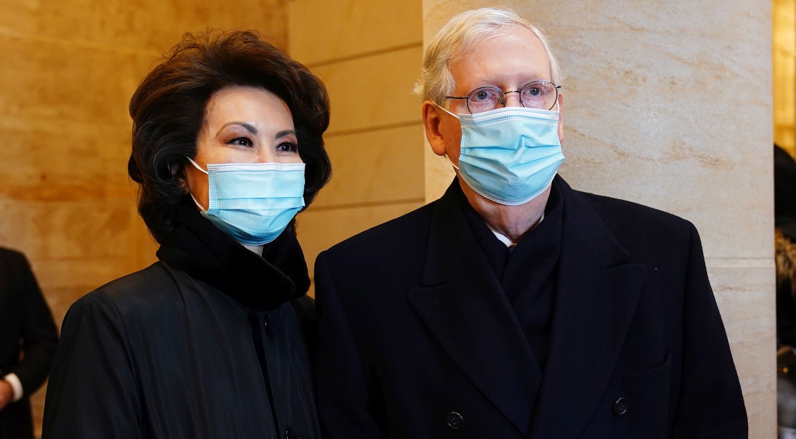 epa08951870 Senate Majority Leader Mitch McConnell (R) and former Secretary of Transportation Elaine Chao (L) before President-elect Joe Biden arrives at the East Front of the US Capitol for his inauguration ceremony to be the 46th President of the United States in Washington, DC, USA, 20 January 2021. Biden won the 03 November 2020 election to become the 46th President of the United States of America.  EPA/JIM LO SCALZO / POOL