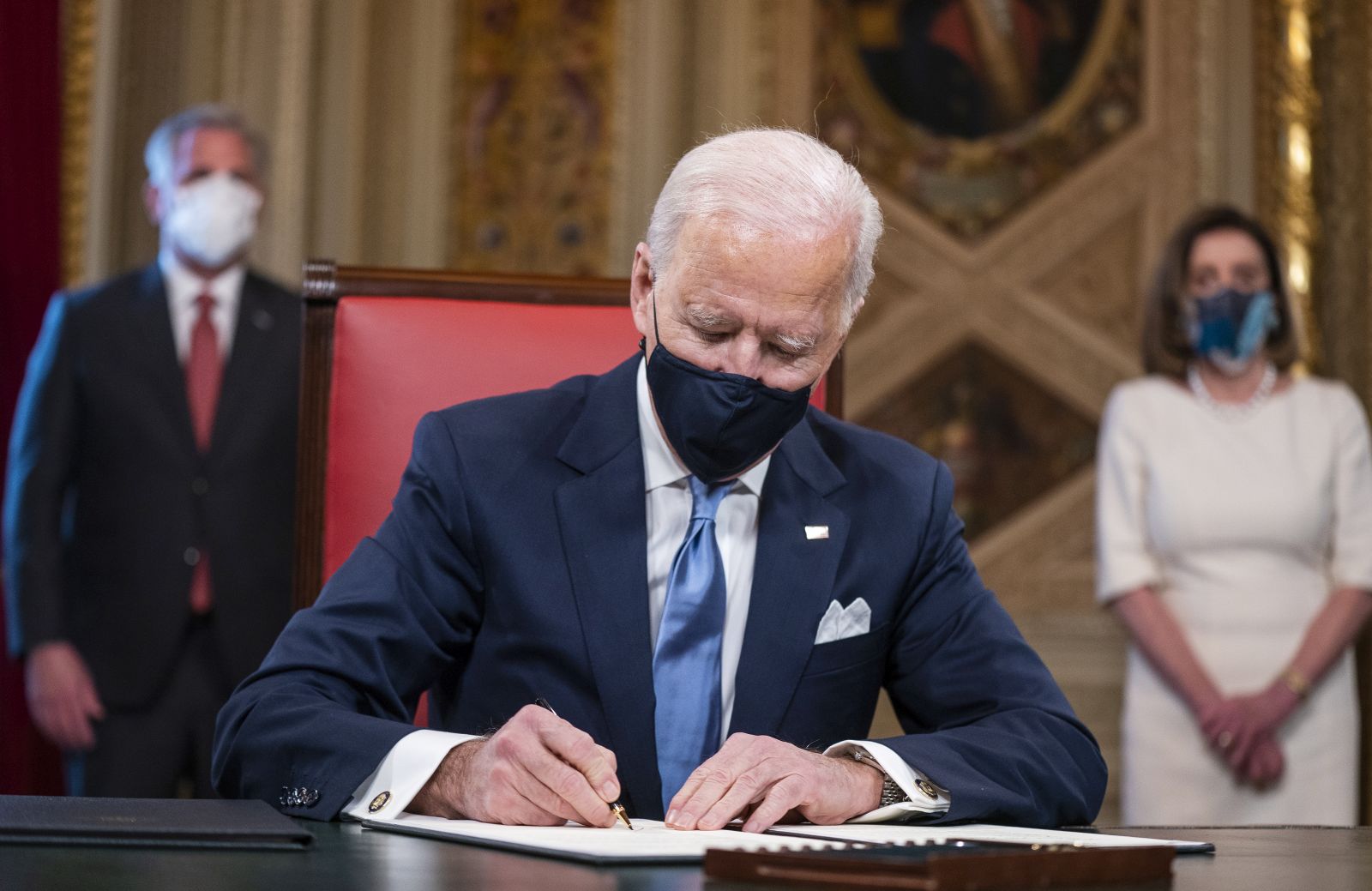 epaselect epa08953568 US President Joe Biden signs three documents including an Inauguration declaration, cabinet nominations and sub-cabinet noinations in the Presidents Room at the US Capitol after the inauguration ceremony to making Biden the 46th President of the United States in Washington, DC, USA, 20 January 2021. Biden won the 03 November 2020 election to become the 46th President of the United States of America.  EPA/JIM LO SCALZO / POOL