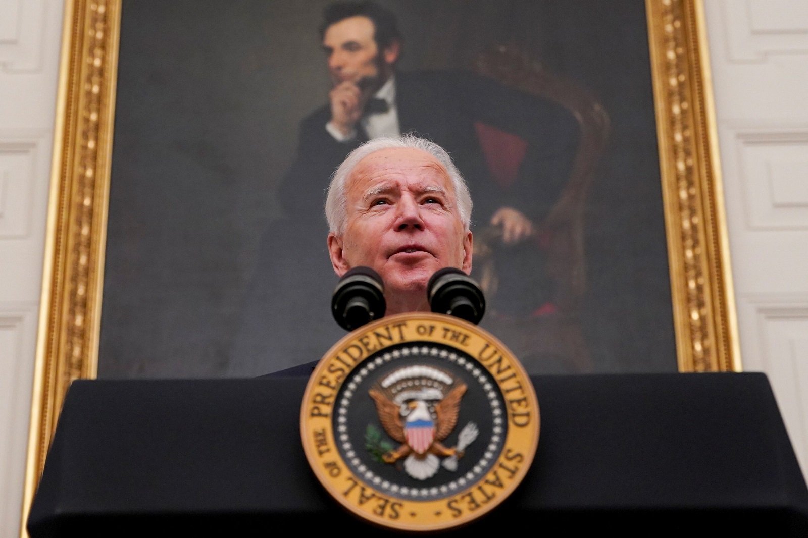 epa08956395 US President Joe Biden speaks during an event on his administration's Covid-19 response in the State Dining Room of the White House in Washington, DC, USA, on 21 January 2021. Biden in his first full day in office plans to issue a sweeping set of executive orders to tackle the raging Covid-19 pandemic to rapidly reverse or refashion many of his predecessor's most heavily criticized policies.  EPA/Al Drago / POOL