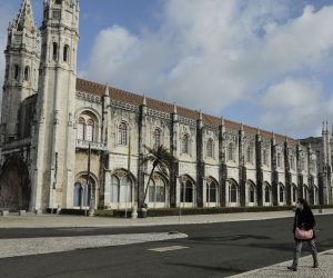 epa08957560 A pedestrian walks near Jeronimos Monastery in Lisbon, Portugal, 22 January 2021. All schools at all levels of education are closed as of 22 January for two weeks, a measure announced on 21 January by the government to contain the COVID-19 pandemic.  EPA/MIGUEL A. LOPES