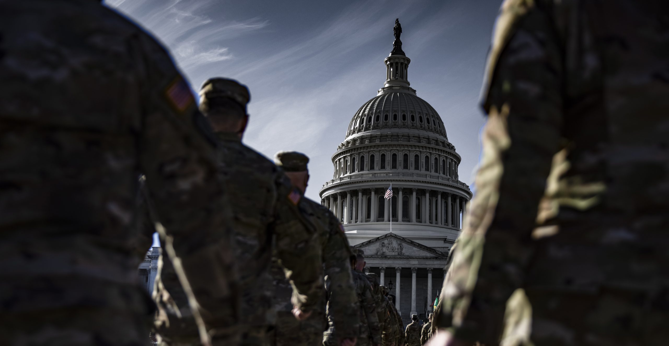 epa08958805 Members of the New York National Guard  march in formation on the east front of the US Capitol building on Capitol Hill in Washington, DC, USA, 22 January 2021. Approximately 25,000 National Guard troops from all over the country were activated in order to protect the US Capitol and other locations in Washington following the January 6th attack on the Capitol by a pro-Trump mob.  EPA/SAMUEL CORUM