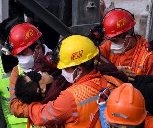 epa08961562 A picture released by Xinhua News Agency shows a trapped miner being lifted from a gold mine in Qixia City, east China's Shandong Province, 24 January 2021. The miner, who has been trapped underground for two weeks after a blast in a gold mine, was found by rescuers on 24 January morning that who is in extremely weak condition, was lifted from the mine at 11:13 a.m. on 24 January 2021. As many as twenty-two miners have been trapped about 600 meters underground since the mine blast on 10 January 2021 in Qixia, east China's Shandong Province.  EPA/CHEN HAO/XINHUA -- MANDATORY CREDIT: XINHUA --  EDITORIAL USE ONLY/NO SALES