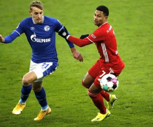 epa08962255 Schalke's Timo Becker (L) in action against Bayern's Serge Gnabry (R) during the German Bundesliga soccer match between FC Schalke 04 and FC Bayern Munich in Gelsenkirchen, Germany, 24 January 2021.  EPA/LEON KUEGELER / POOL DFL regulations prohibit any use of photographs as image sequences and/or quasi-video.
